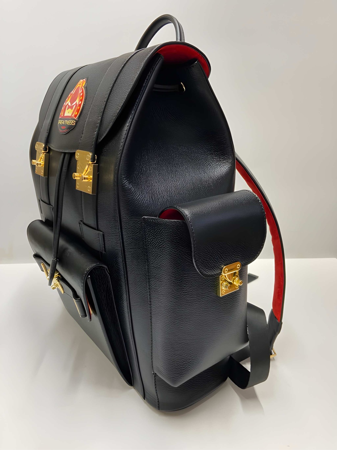 SIYL The Greatness Backpack — three-quarter view showing side pocket