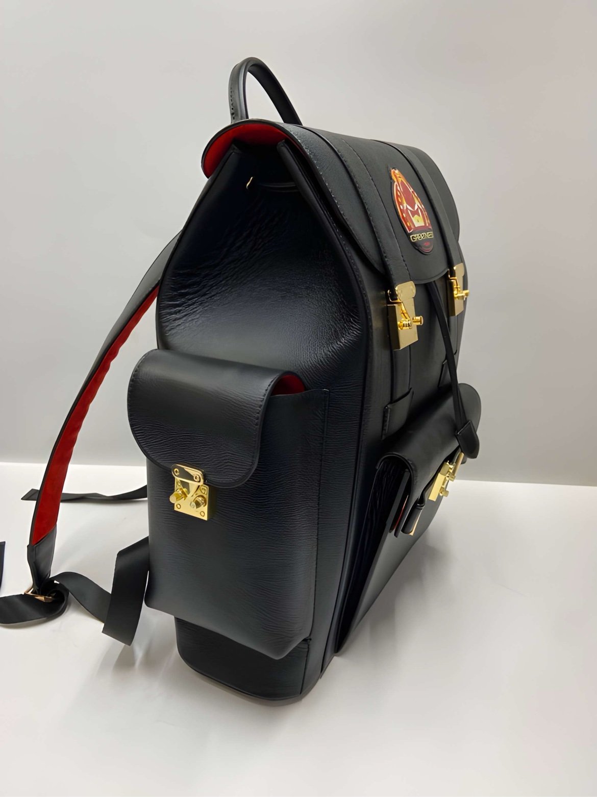 SIYL The Greatness Backpack — side view with red trim pocket